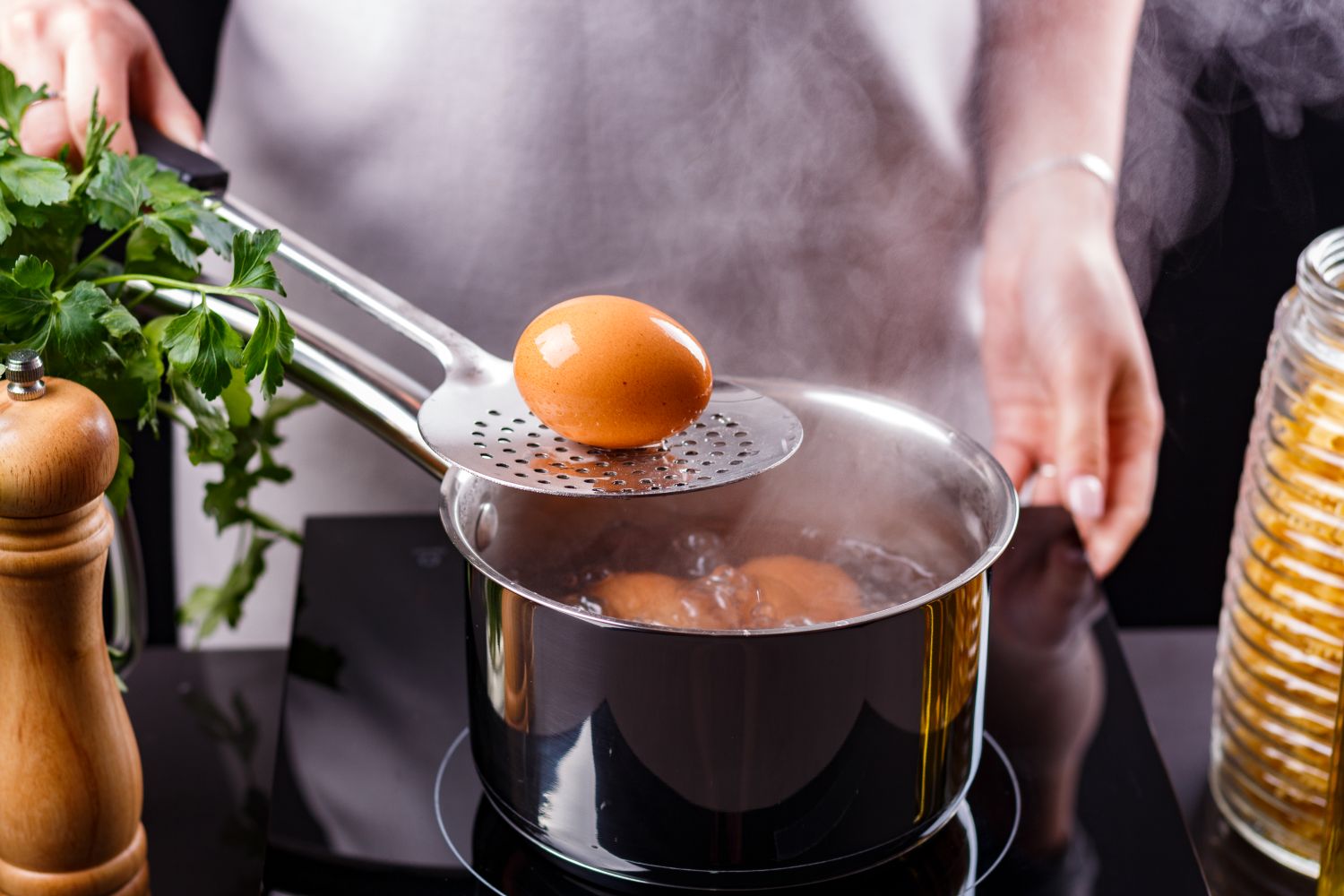 woman boiling eggs